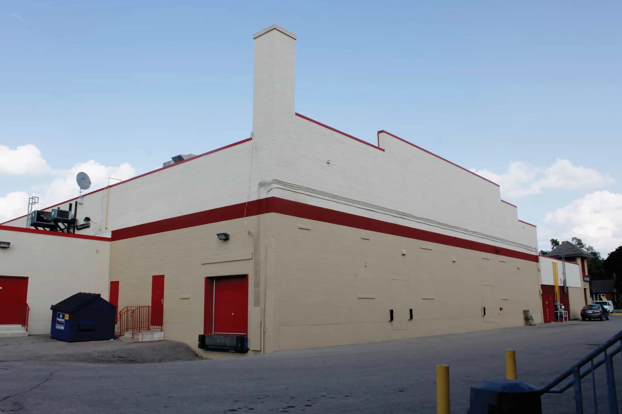 Commercial building exterior with maintained facade and siding