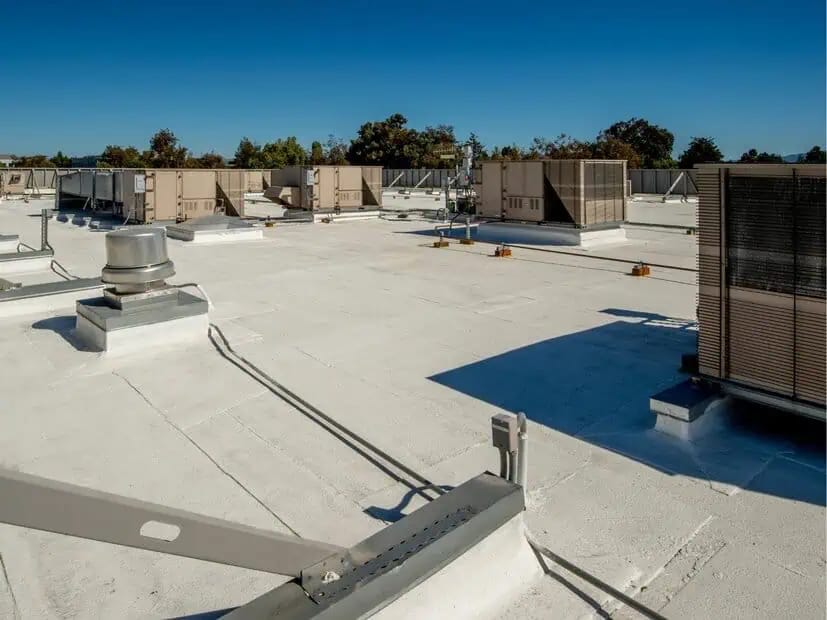 Coated commercial roof and weather-exposed surfaces