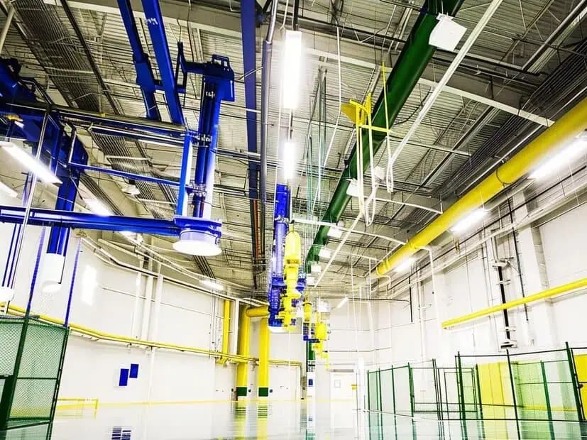 Industrial interior with coated structural surfaces and equipment