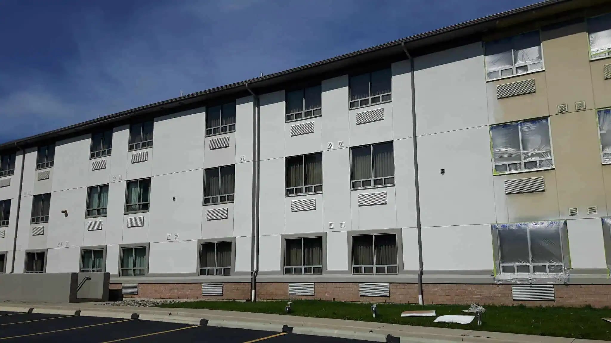 Coated commercial roof and weather-exposed surfaces