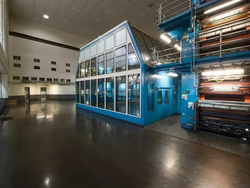 Industrial interior with coated structural surfaces and equipment