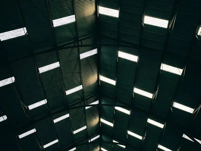 Industrial interior with coated structural surfaces and equipment