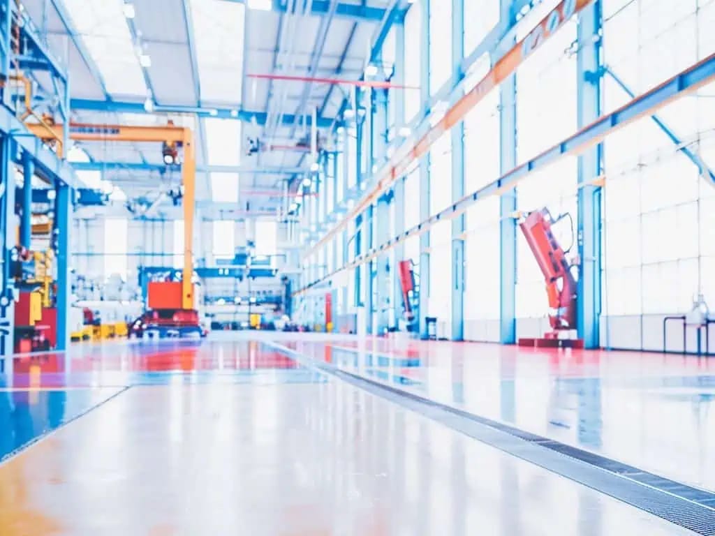 Industrial interior with coated structural surfaces and equipment