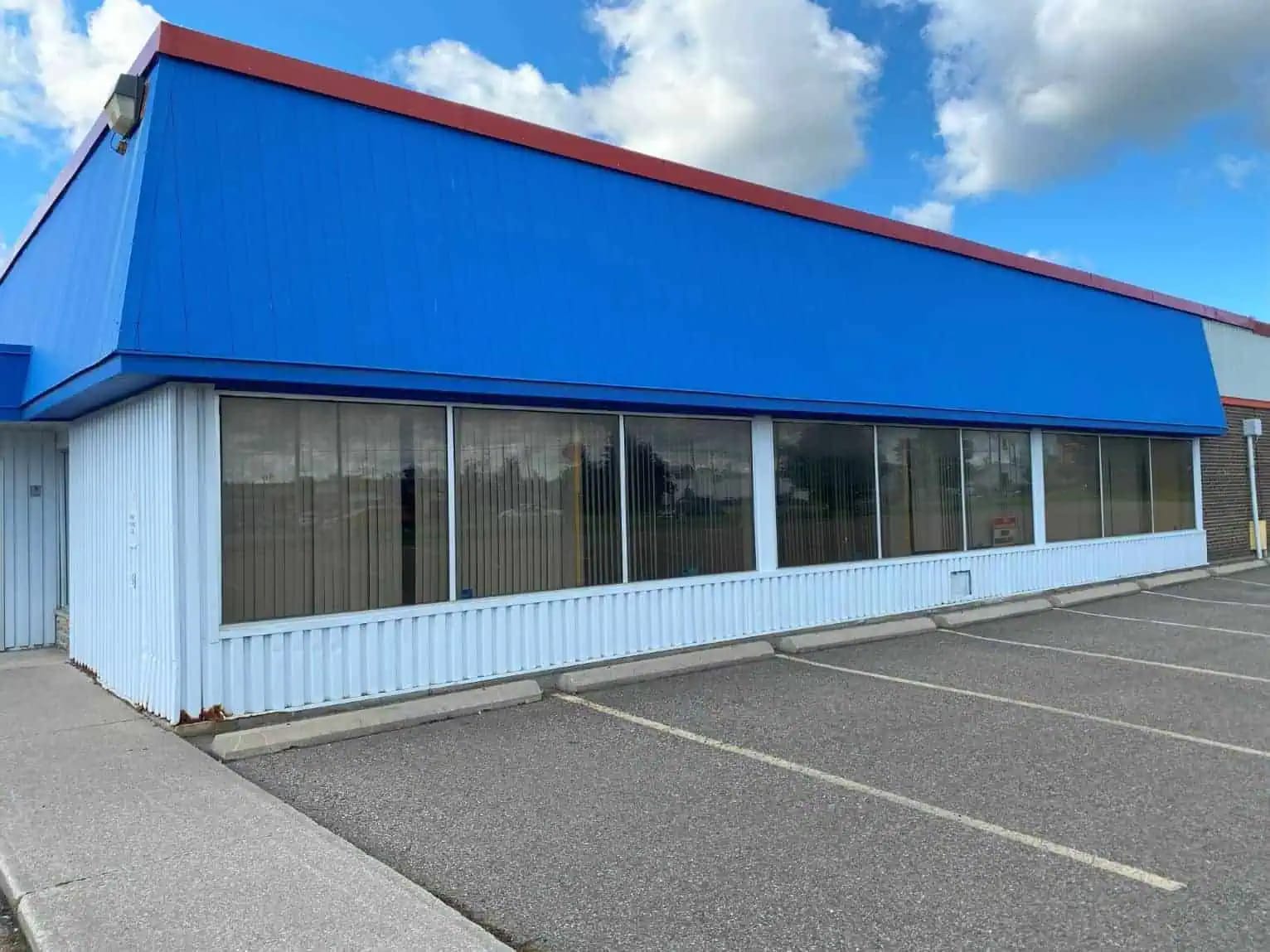 Commercial building exterior with maintained facade and siding